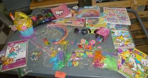 lot 205 image: Girls hair accessories, sketch book, activity books, sun glasses