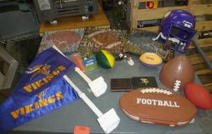 lot 209 image: Football lot - Vikings car flags, Vikings billfolds, footballs, book on NFL, wall hangings, talking ball