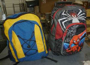 lot 233 image: Two backpacks with sleeping bags inside