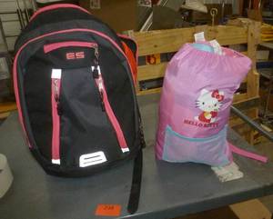lot 238 image: Two backpacks with sleeping bags inside - Hello Kitty and Lightning McQueen