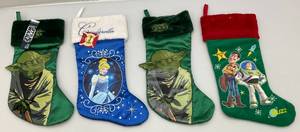 lot 141 image: Misc. Collectible Christmas Socks Including STAR WARS Yoda, Cinderella and Toy Story (Two New With Tags)