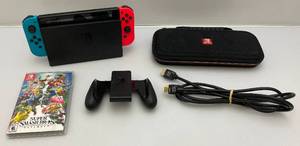 lot 147 image: Nintendo Switch With Games Including Super Smash Bros, Brawlhalla Carrying Case  & Accessories (WORKS)