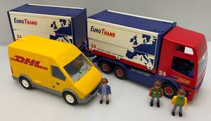 lot 204 image: Vintage PlayMobil People DHL Truck and Euro Trans Toy Trucks