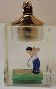 lot 17 image: Vintage Lighter 1950s Golfer In Sand Trap Lucite Evan Table Lighter