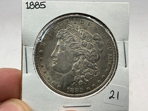 lot 21 image: 1885 Morgan Silver Dollar