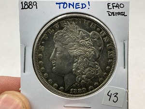 lot 43 image: 1899 Morgan Silver Dollar