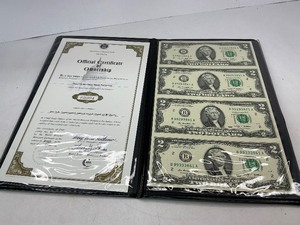 lot 142 image: Uncut Sheet of $2 bills in Display Folio