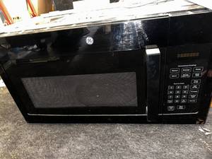 lot 106 image: GE Over-the-Range Microwave Oven with Convenience Cooking Controls