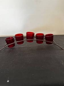 lot 139 image: Set of 5 Red Glass Candle Holders with Iron Rack