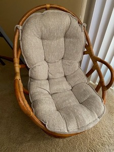 lot 152 image: Rattan Swivel Chair with Cushion and Red Accent Pillow