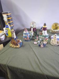 lot 90 image: Collection of Lighthouse Figurines and Snow Globes