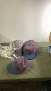 lot 138 image: Set of 24 Unopened Yupoong Snapback Caps in Purple and Blue