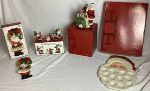 lot 124 image: Fitz and Floyd Santa Collection - Holiday Home Tumblers, Peppermint Santa Egg Tray, Holiday Cheer Spoon Rest, and Santa with Toy Bag Musical