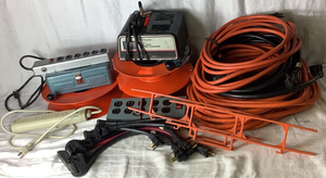 lot 177 image: Garage Essentials Collection - Electrical Cords, Adapters, Battery Charger, Power Strips and Storage Reels