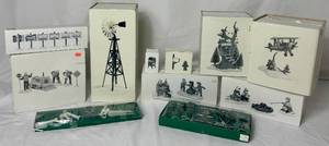 lot 247 image: Department 56 Snow Village Accessories - Windmill, Lampposts, Mailbox, At the Barn Dance, Election Signs, Kids Tree House, Spirit of Snow Village Airplane, Marshmallow Roast and Men at Work