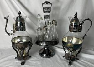 lot 214 image: Pair of Vintage Silver Plated Coffee Carafes with Warmer Stands and Silver Plated Etched Cruet Condiment Set with Footed Caddy