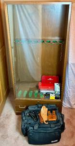 lot 299 image: Vintage Gun Cabinet - 8 Gun Rack with Keys and Bottom Storage Drawer includes Holsters, Gun Lock, Midway USA Competition Range Bag and Gun Cleaning Kits