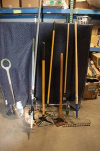 lot 31 image: Assortment of Garden Tools Including Shovels, Rakes, and Hoe