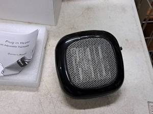 lot 761 image: Portable Plug-In Heater (in original packaging)