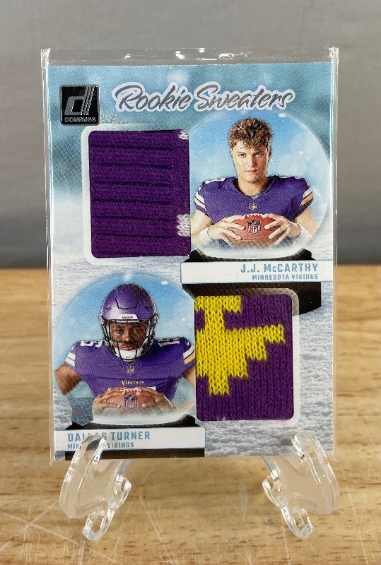 lot 46 image: 2024 Panini Donruss JJ McCarthy, Dallas Turner Rookie Sweaters #RHD-MIN T