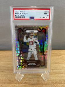 lot 42 image: 2023 PRIZM Brock Purdy Pandora #266 PSA Mint 9 - Numbered 250400 J