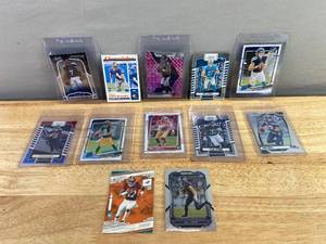 lot 294 image: Set of 12 Assorted NFL Football Trading Cards with Protective Sleeves J