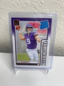 lot 328 image: J.J. McCarthy Panini Donruss Rated Rookie Throwback Vikings Trading Card #2 M