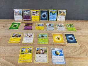 lot 744 image: 20 Pokemon Trading Cards with Energy and Trainer Cards T