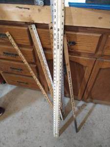lot 241 image: Yard Sticks, Wood Metal Plastic