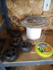 lot 412 image: Mower Support Wheels, Weed Trimmer Line, Etc