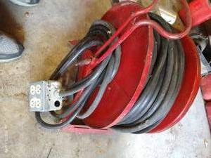lot 562 image: Roll of Heavy Duty Extension Cords