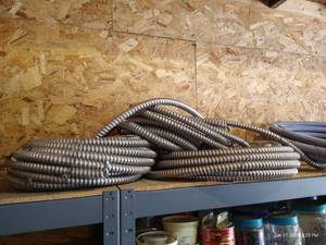 lot 572 image: Three Coils Electrical Conduit