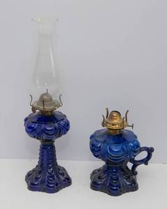 lot 634 image: Set of Two Antique Cobalt Blue Oil Lamps  Eagle & Victor