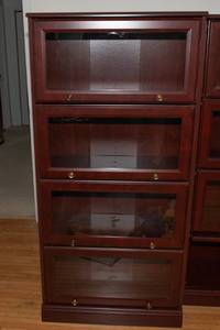 lot 553 image: Sauder Cherry-Tone Laminate Barrister-Style Bookcase with Glass Doors  60T x 28.5L x 12D (#1)