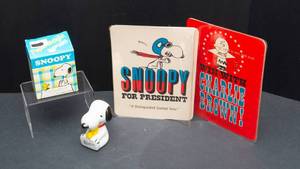 lot 762 image: Peanuts Collectables - Snoopy Paperweight and Four Oversized Postcards