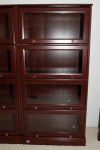 lot 621 image: Sauder Cherry-Tone Laminate Barrister-Style Bookcase with Glass Doors  60T x 28.5L x 12D (#7)