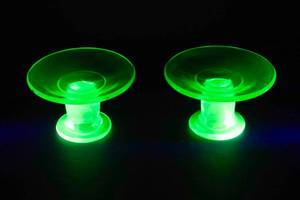lot 826 image: Two Uranium Glass Candle Holders