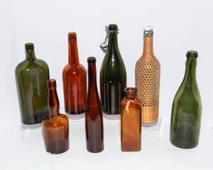 lot 845 image: A Set of Eight Vintage Bottles in Colored Glass