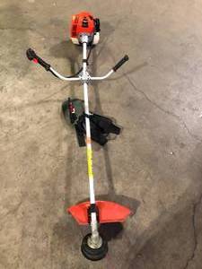lot 27 image: Echo Trimmer  missing Parts   Customer Returns See Pictures