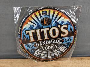 lot 51J image: Brand New Titos Handmade Vodka 8-Inch Round Tin Sign