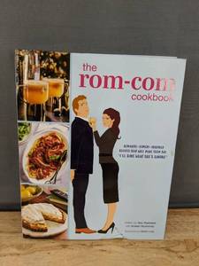 lot 610 image: New The Rom-Com Cookbook by Tara Theoharis -$27.99 Retail