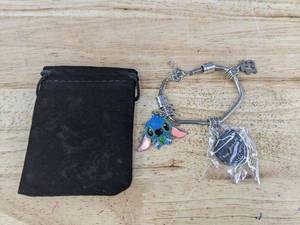 lot 84J image: Brand New Stitch Bracelet with Charms and Heart Pendant