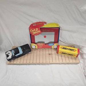 lot 22 image: Vintage Etch a Sketch, as new and Novelty Tin Boxes