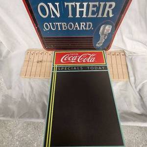 lot 87 image: Johnson Outboards and Coca Cola Signs