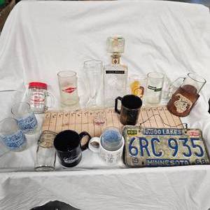 lot 94 image: Lot of Glasses including Grain Belt Mug and 1968 License Plates
