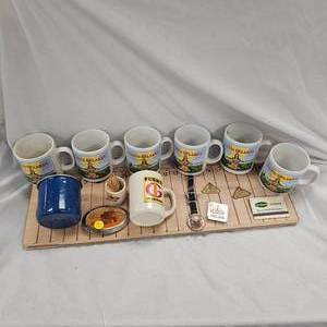 lot 95 image: Set of LandOLakes Coffee Mugs and Trojan Collectibles