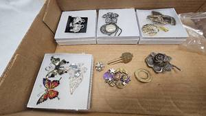 lot 75 image: Assorted Vintage Jewelry Lot, including silver Toned Earnings, Key Tie Clip, and beautiful silver rose pin