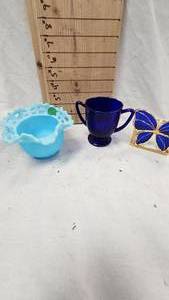 lot 112 image: Fenton Ruffled Satin Chester Glass Vase and Cobalt Blue Creamer, Butterfly