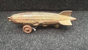 lot 2 image: Antique Cast Iron Zeppelin Penny Bank with Wheels