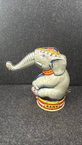 lot 12 image: Vintage Tin Elephant Coin Bank with Circus Design